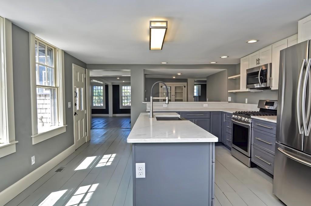 1874 Main Road Westport, MA 02791 - Photo 6 of 28 a kitchen with kitchen island granite countertop a sink stainless steel appliances and cabinets