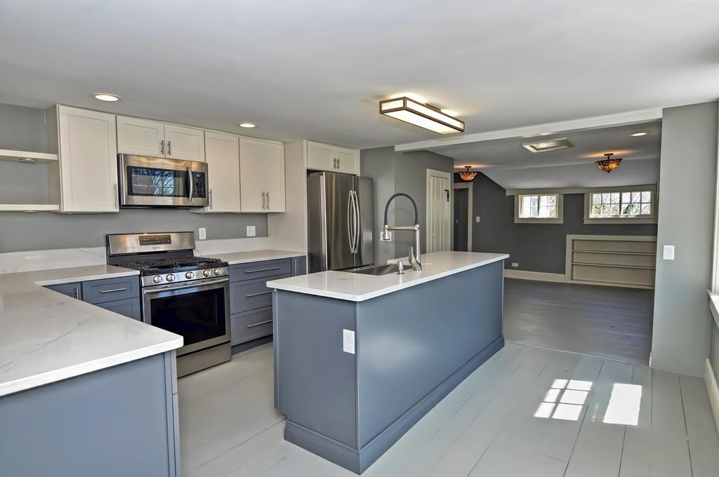 1874 Main Road Westport, MA 02791 - Photo 7 of 28 a large kitchen with stainless steel appliances granite countertop a sink stove and refrigerator