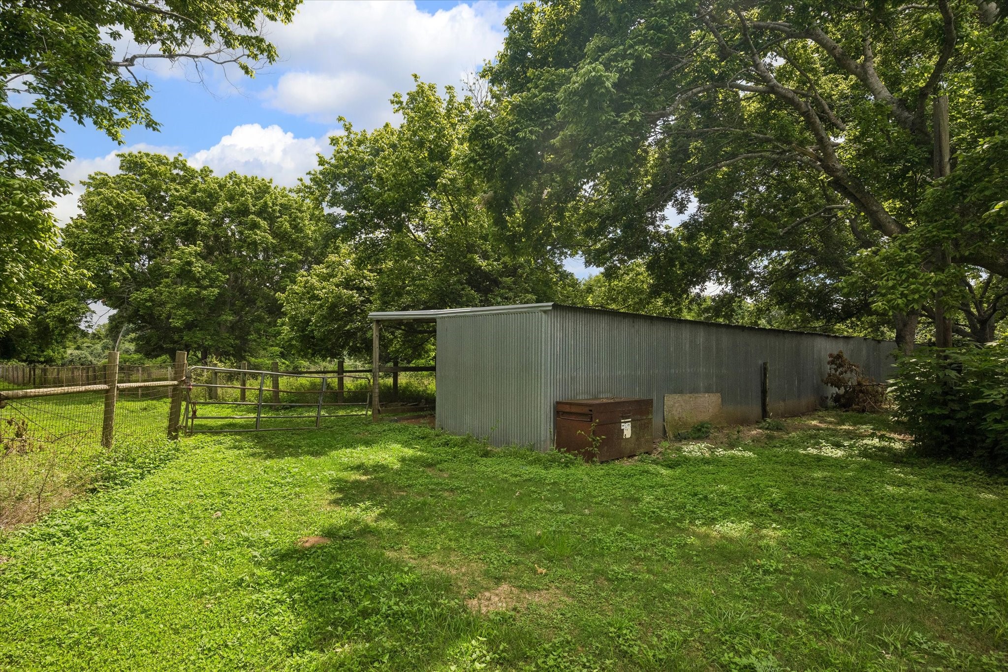 2511 Hartwell Road Pattison, TX 77423 - Photo 20 of 27 Spacious barn with multiple stalls and room for equipment, feed, and storage.
