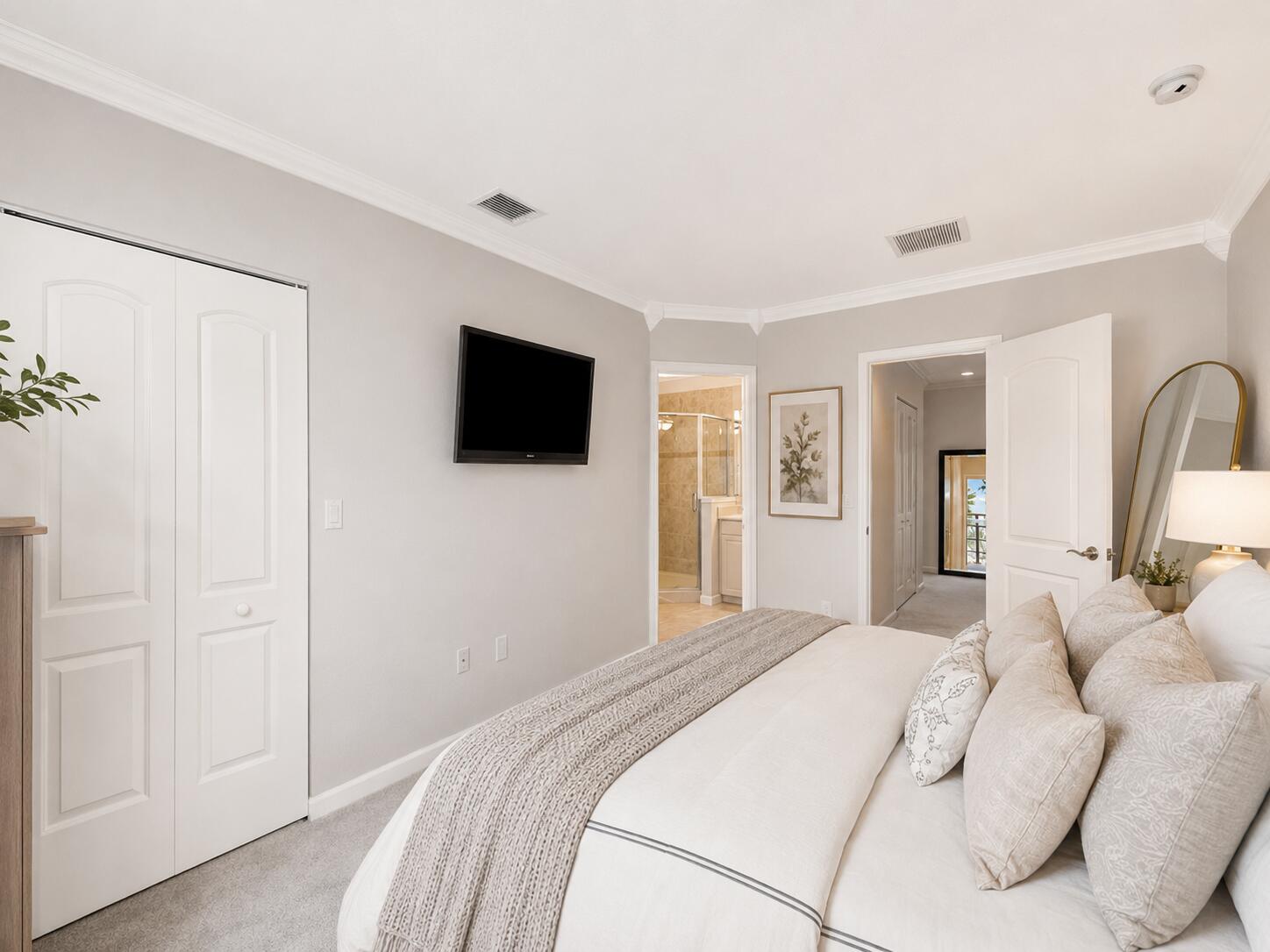 4792 Sundance Way, Unit 4792 Davie, FL 33328 - Photo 8 of 25 a bedroom with a bed and a flat screen tv