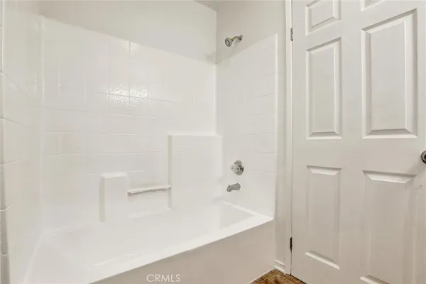 a kitchen with cabinets and washer