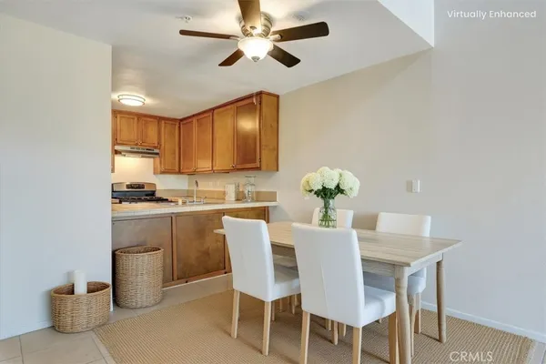 a kitchen with granite countertop white cabinets and stainless steel appliances