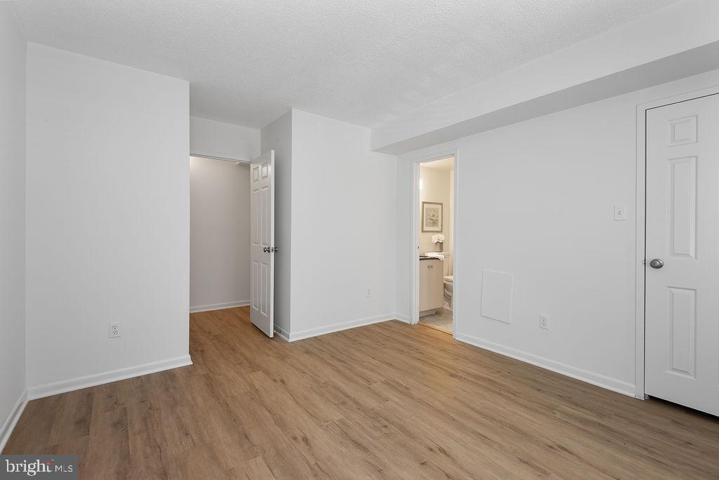 11600 Stoneview Square, Unit 60/2B Reston, VA 20191 - Photo 5 of 27 an empty room with wooden floor