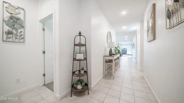 a view of kitchen with furniture and refrigerator
