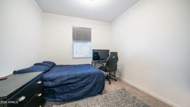 a view of workspace with furniture and window