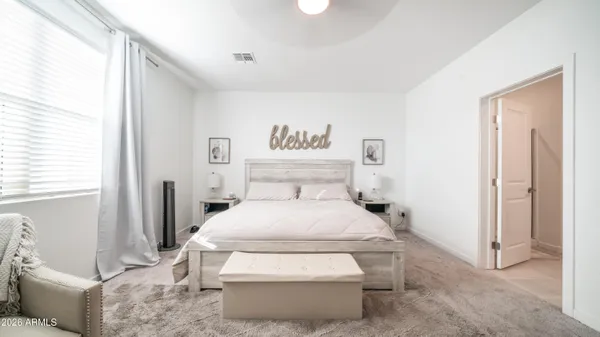 a bed room with a bed and a couch