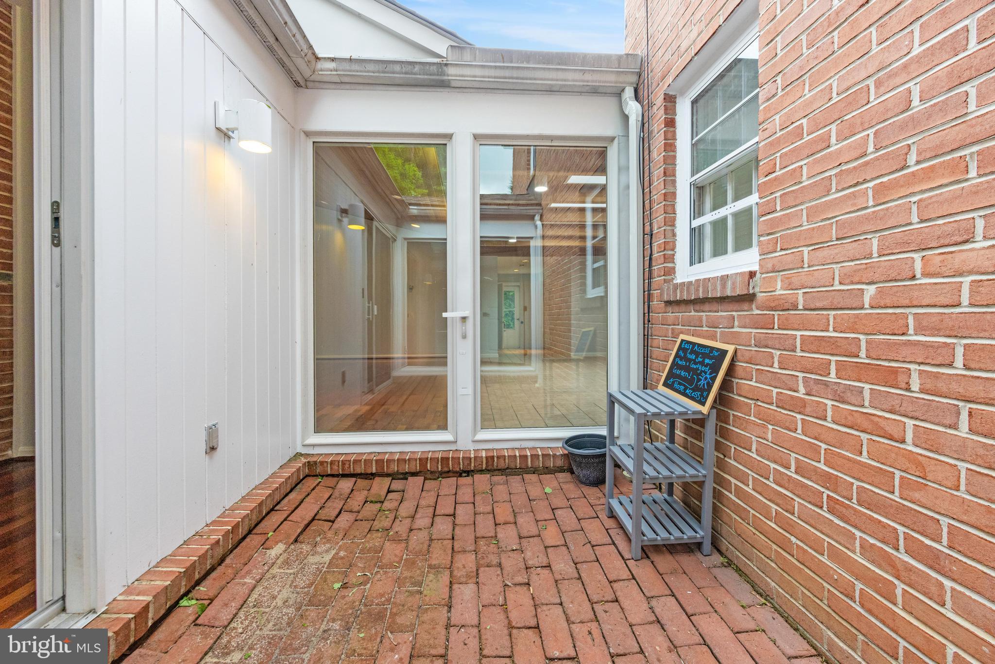 1807 Thornton Ridge Road Baltimore, MD 21204 - Photo 25 of 57 a view of a brick wall with a window and chair