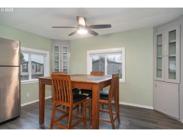 a dining room with furniture and window