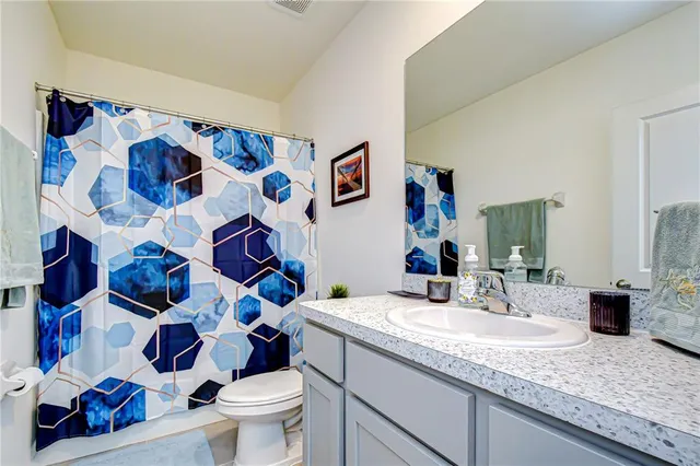 a view of a house with a yard and plants