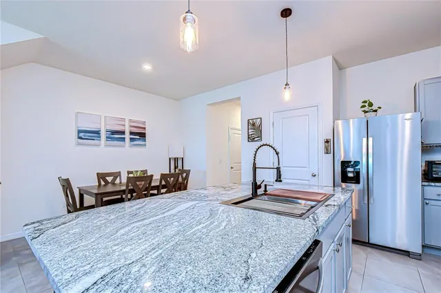 a view of a dining room with furniture and window
