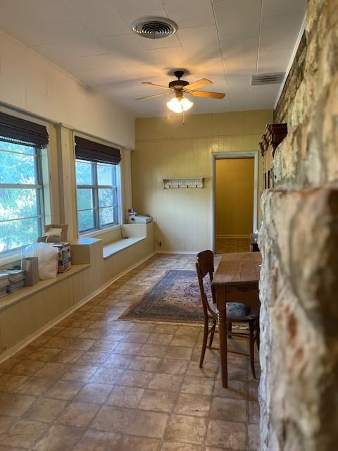 248 South Jacobs Street Albany, TX 76430 - Photo 13 of 17 Sunroom with lots of windows and window seats with storage.