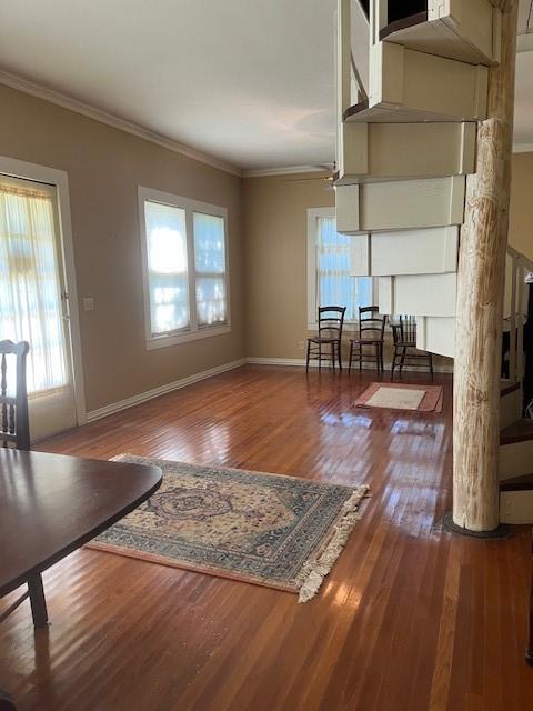 248 South Jacobs Street Albany, TX 76430 - Photo 4 of 17 Living/ Dining Room with beautiful hardwood floors and crown molding