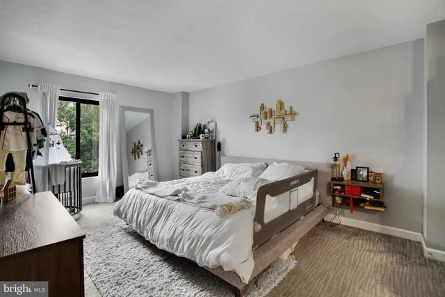 a bed room with a bed and a couch