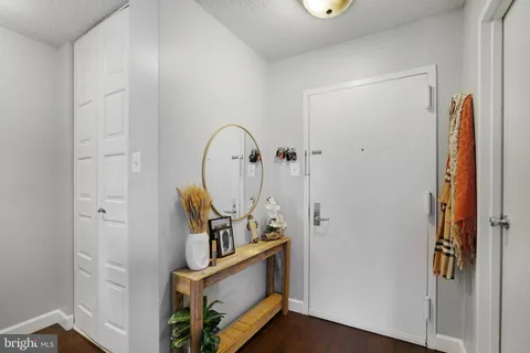 a view of living room with furniture and wooden floor