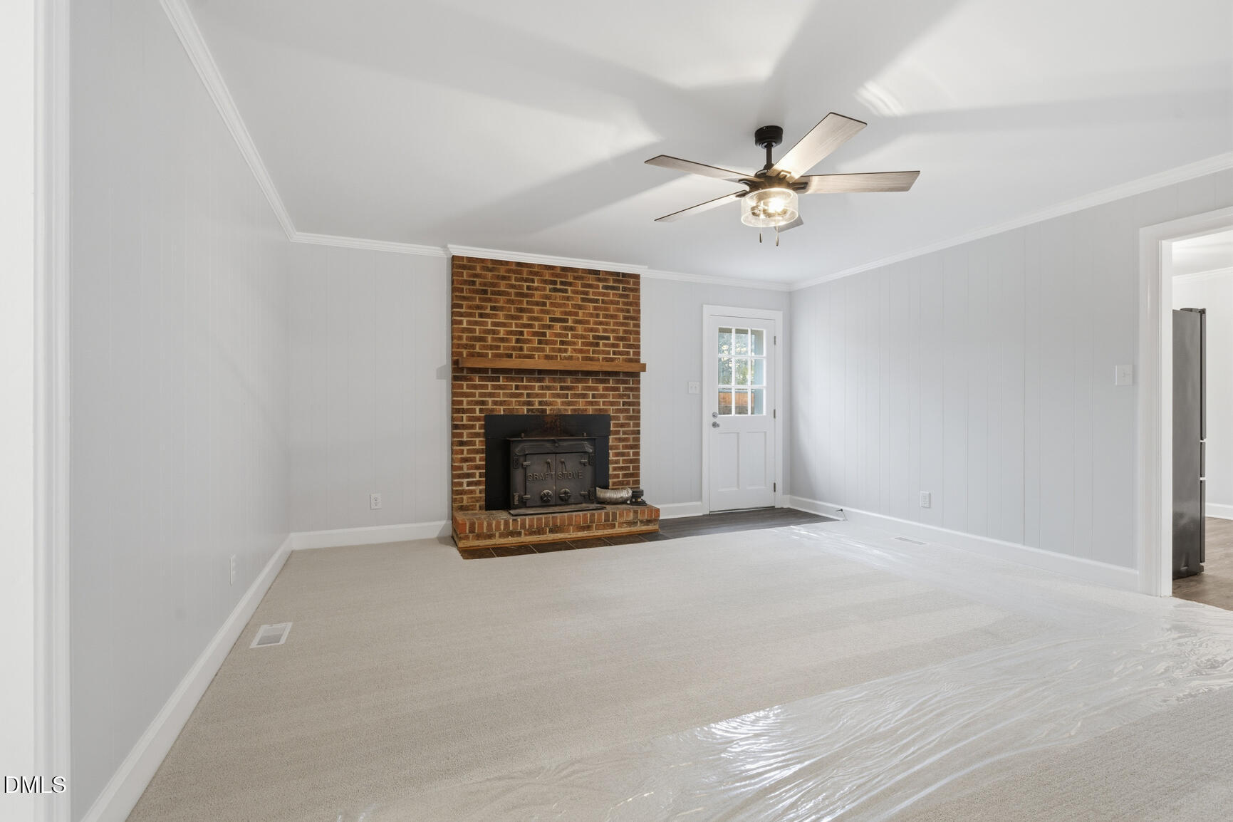 4712 Crest Road Wilson, NC 27893 - Photo 14 of 31 an empty room with windows and fan