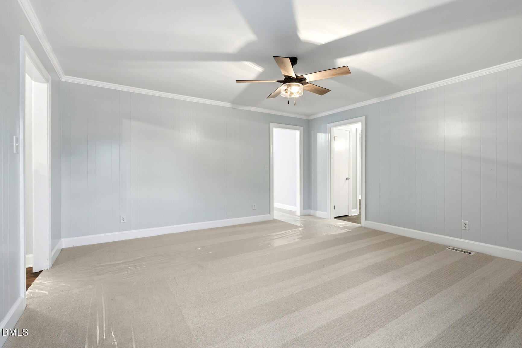 4712 Crest Road Wilson, NC 27893 - Photo 16 of 31 an empty room with windows and fan
