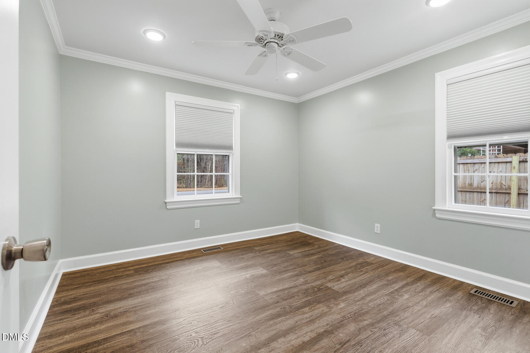 4712 Crest Road Wilson, NC 27893 - Photo 21 of 31 a view of a big room with wooden floor and windows