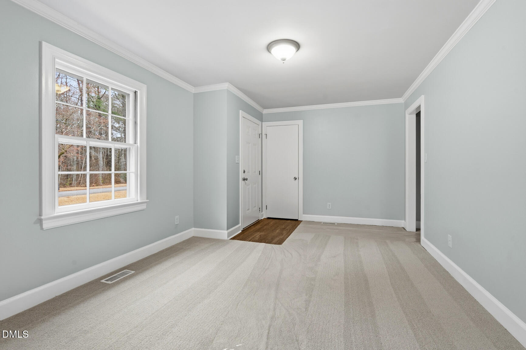 4712 Crest Road Wilson, NC 27893 - Photo 6 of 31 an empty room with windows