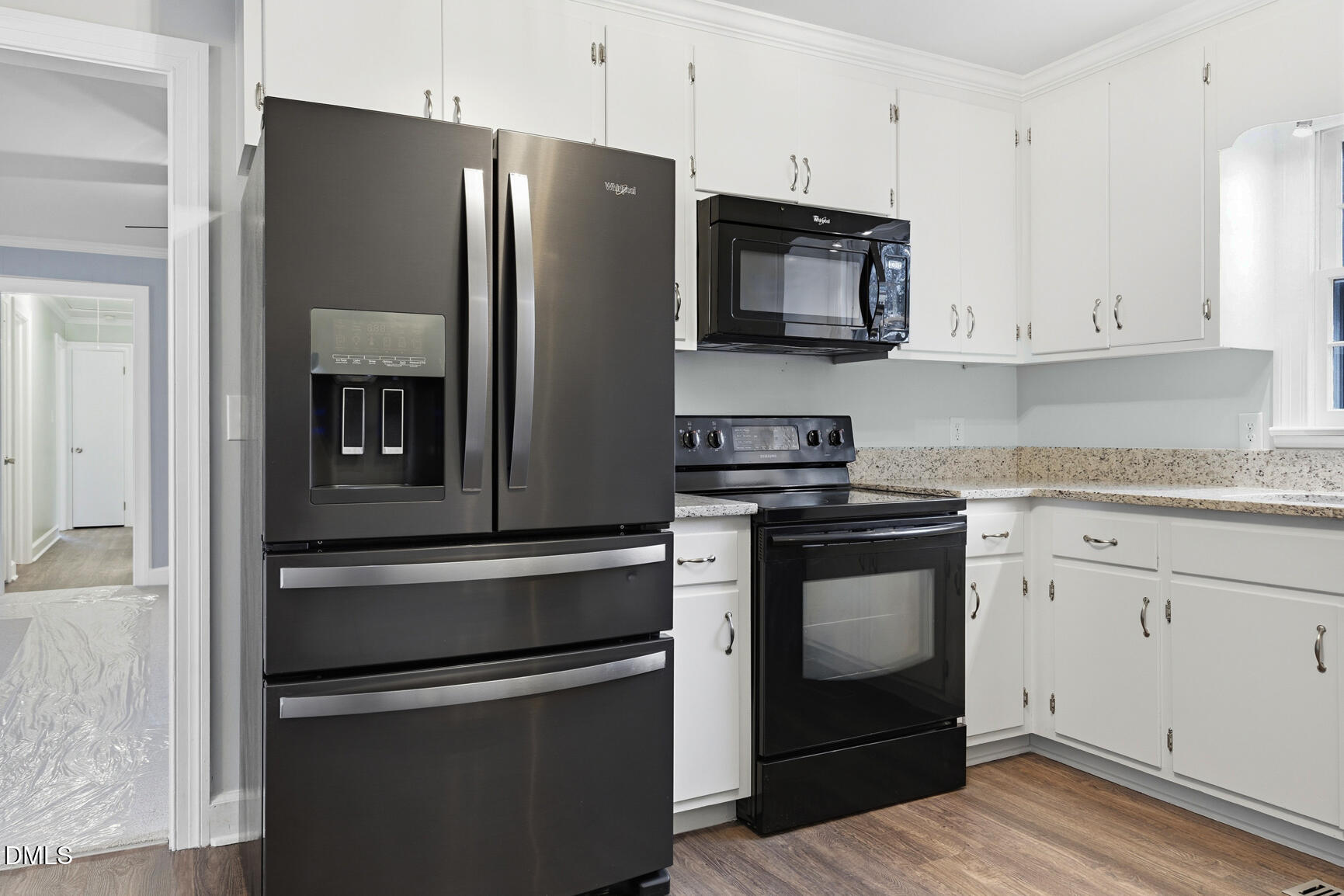 4712 Crest Road Wilson, NC 27893 - Photo 10 of 31 a kitchen with granite countertop stainless steel appliances and wooden cabinets