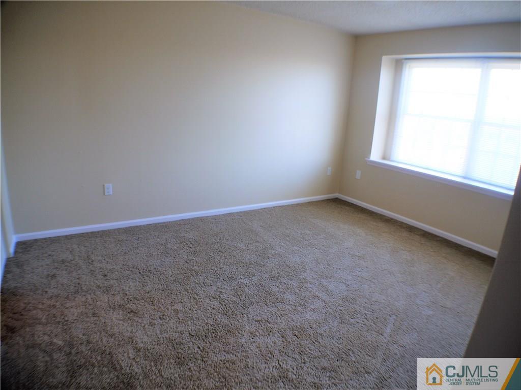 936 Edpas Road, Unit 936 New Brunswick, NJ 08901 - Photo 13 of 21 an empty room with a window