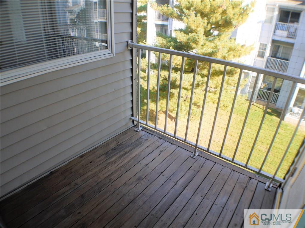 936 Edpas Road, Unit 936 New Brunswick, NJ 08901 - Photo 20 of 21 a view of balcony with wooden floor