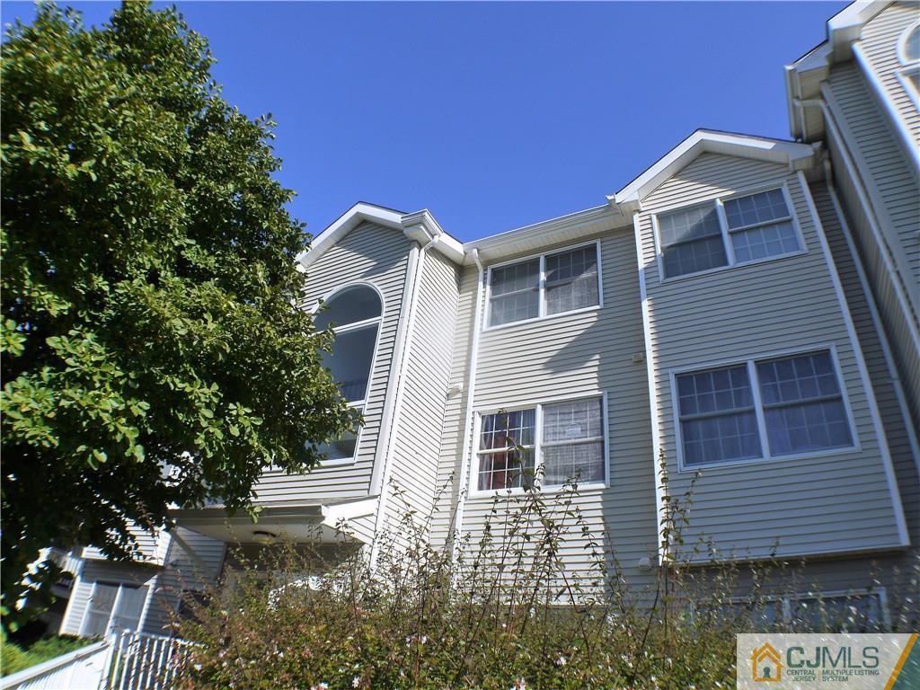 936 Edpas Road, Unit 936 New Brunswick, NJ 08901 - Photo 21 of 21 a front view of a house with garden