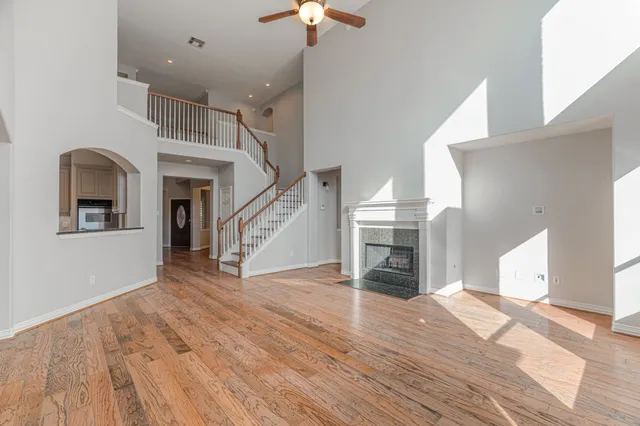 a view of livingroom with dining room and wooden floor