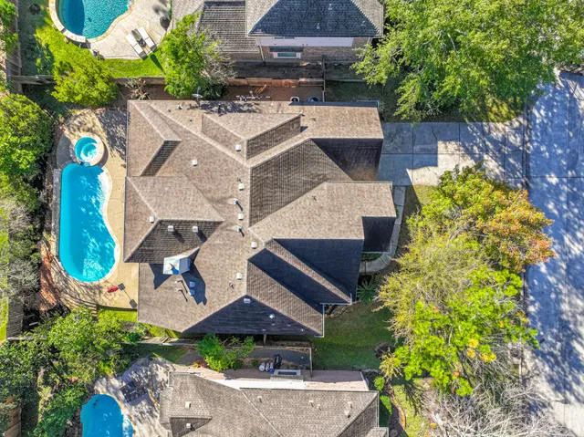 an aerial view of a house with a garden