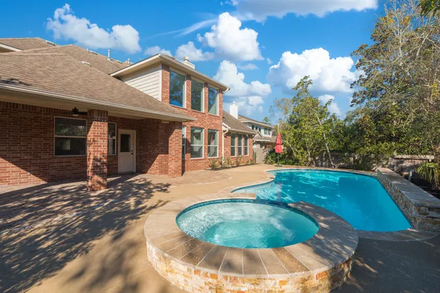a view of a swimming pool with an outdoor space