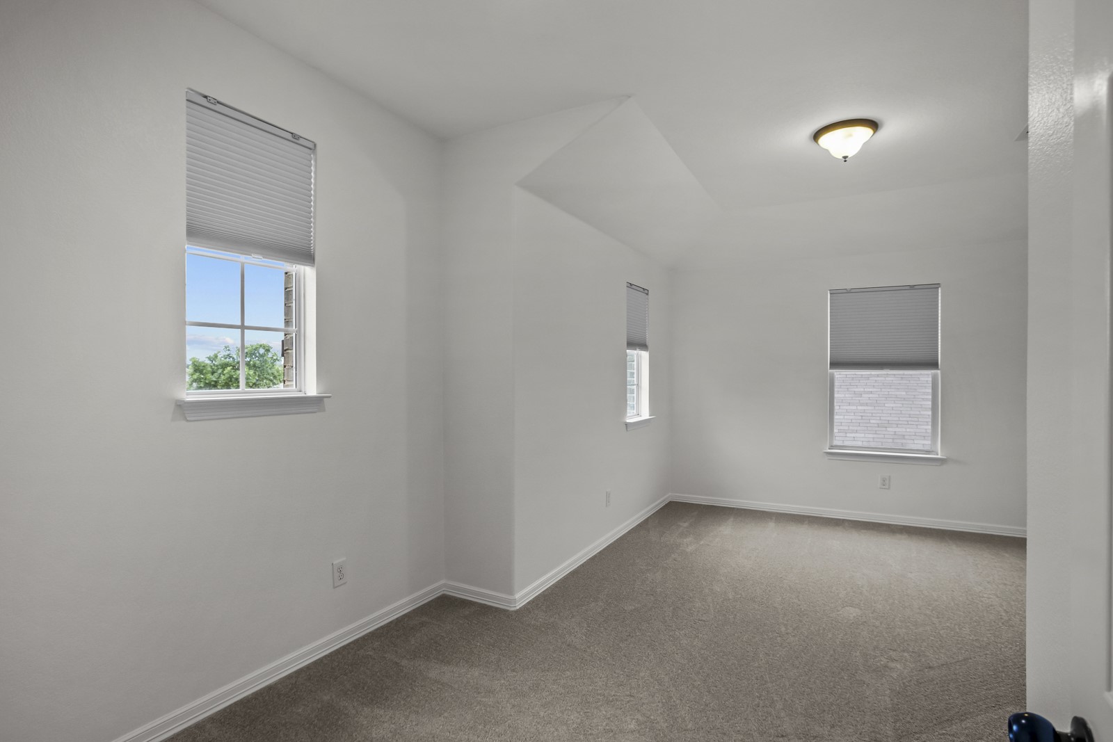 245 Razzmatazz Trail Buda, TX 78610 - Photo 25 of 37 Bright interior space featuring light gray carpeting and white walls