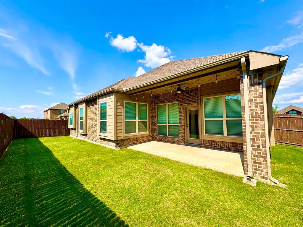 293 Cisco Trail Forney, TX 75126 - Photo 18 of 19 a view of a house with a yard and sitting area