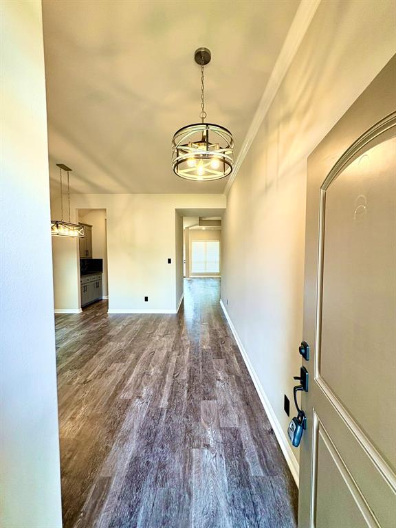 293 Cisco Trail Forney, TX 75126 - Photo 4 of 19 a view of a hallway with wooden floor and staircase