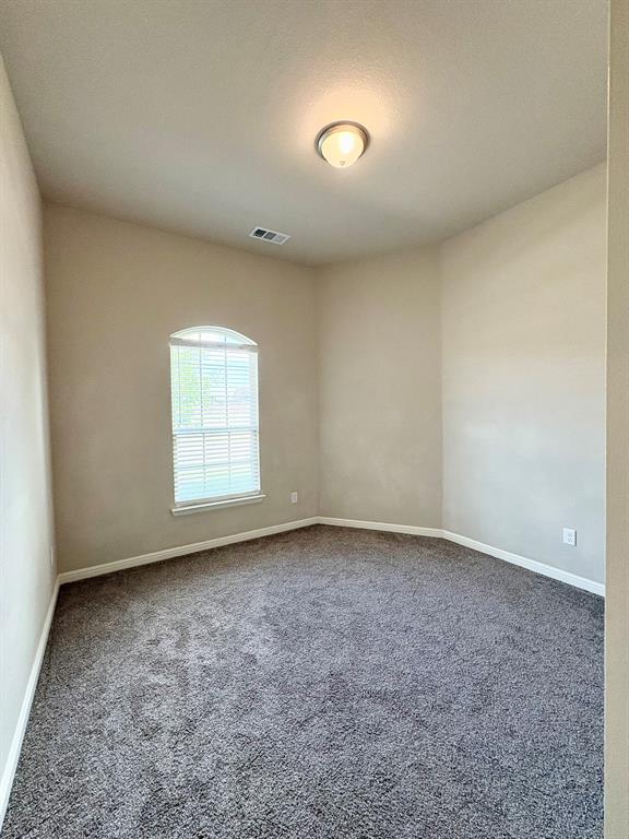 293 Cisco Trail Forney, TX 75126 - Photo 6 of 19 an empty room with a empty space and a window