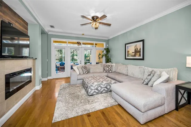a kitchen with stainless steel appliances granite countertop a sink a stove and a wooden cabinets