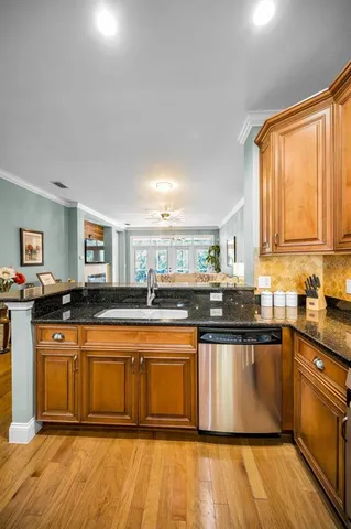 a kitchen with a sink and a refrigerator