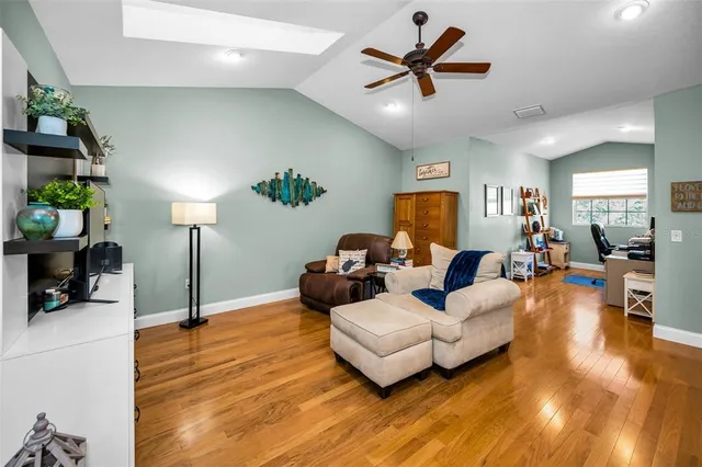a bathroom with a sink a mirror a toilet and a bathtub