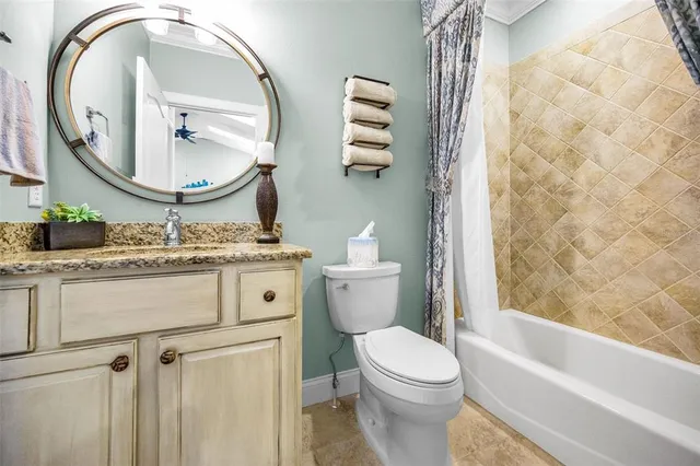 a backyard of a house with table and chairs potted plants