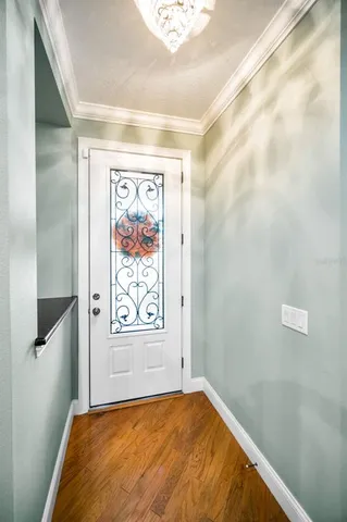 a living room with furniture and a kitchen area