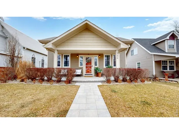 a swimming pool with outdoor seating and yard