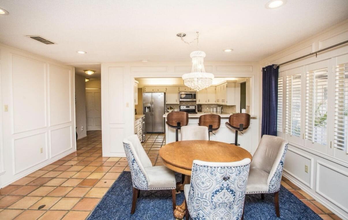 5202 20th Street Lubbock, TX 79407 - Photo 12 of 45 a view of a dining room with furniture window and wooden floor