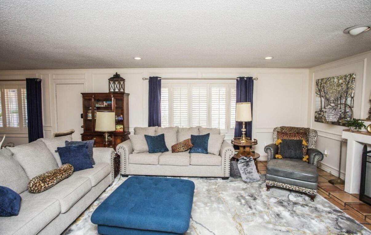5202 20th Street Lubbock, TX 79407 - Photo 18 of 45 a living room with furniture and a couch
