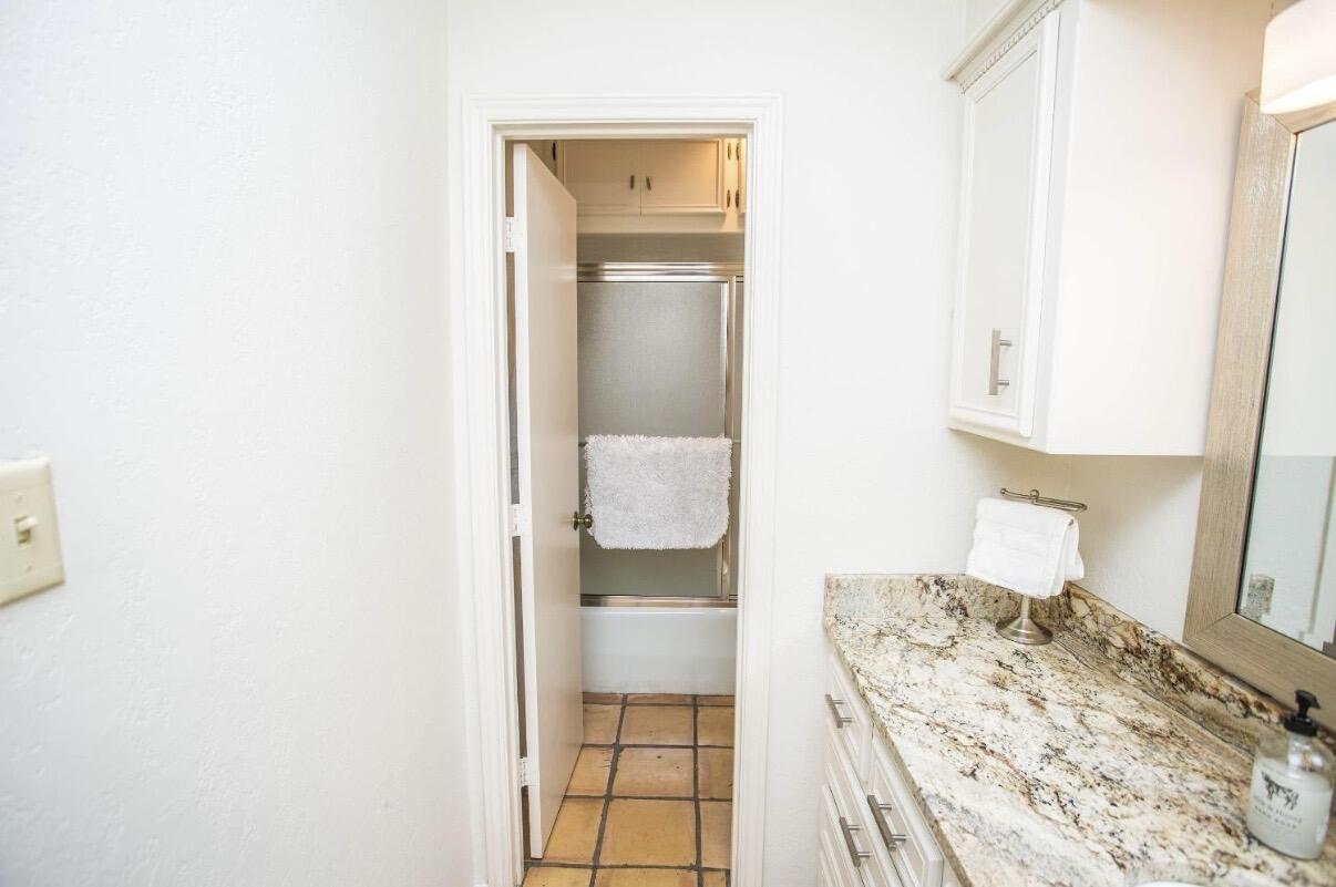 5202 20th Street Lubbock, TX 79407 - Photo 34 of 45 a bedroom with a bed and a window
