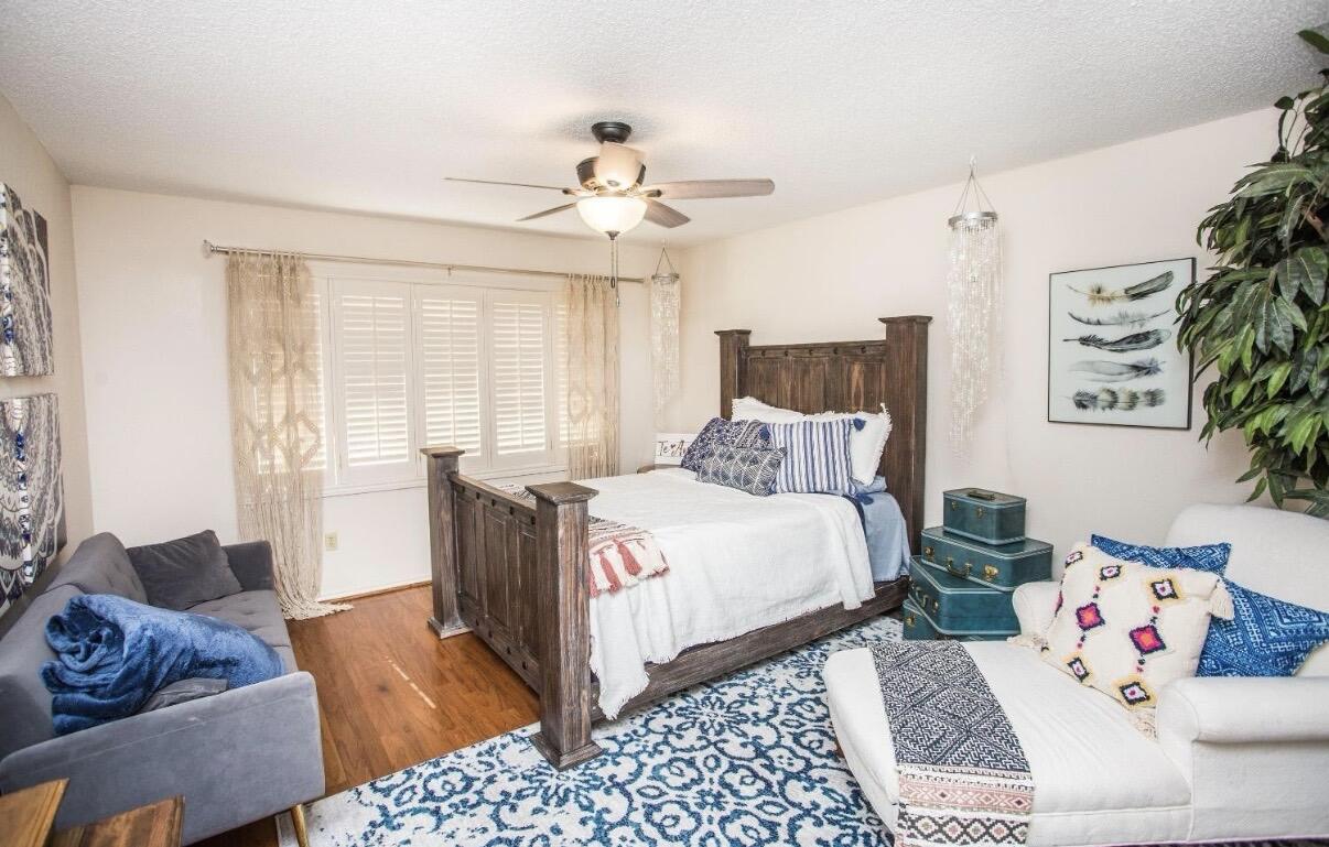 5202 20th Street Lubbock, TX 79407 - Photo 37 of 45 a bed room with a bed and a couch