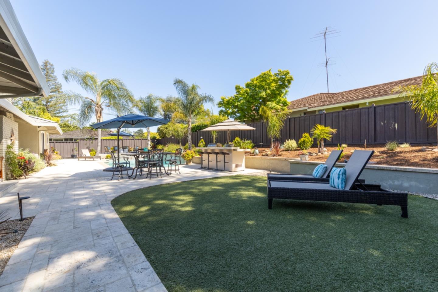 102 Old Orchard Drive Los Gatos, CA 95032 - Photo 25 of 33 a view of a swimming pool with a lounge chairs