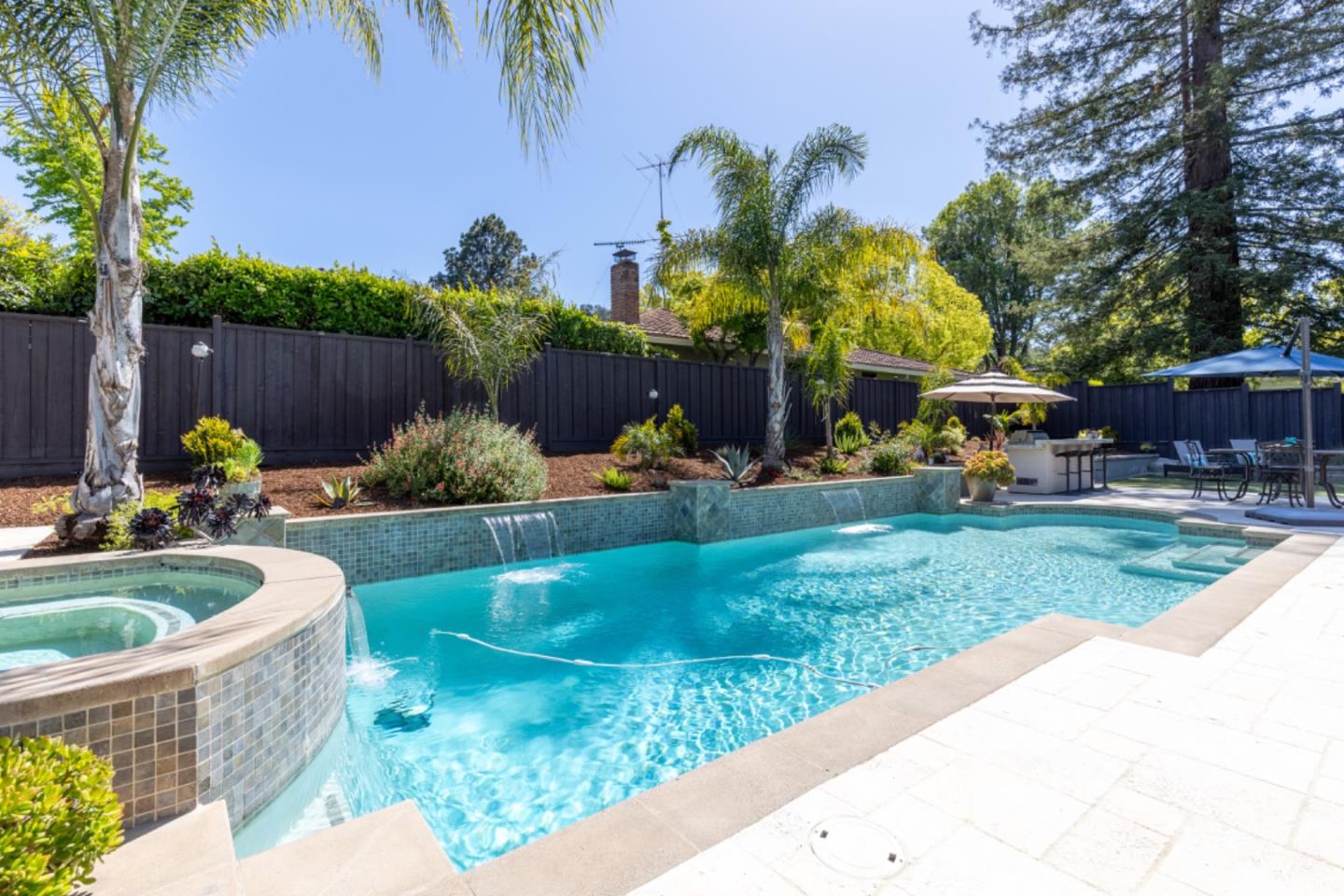 102 Old Orchard Drive Los Gatos, CA 95032 - Photo 28 of 33 a front view of a house with garden and sitting area