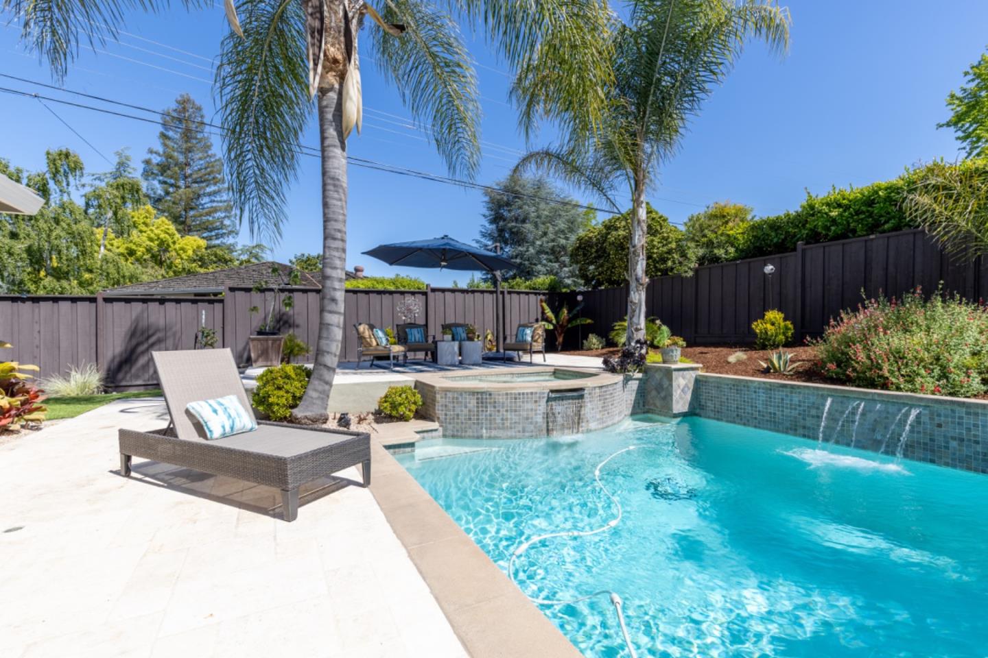 102 Old Orchard Drive Los Gatos, CA 95032 - Photo 30 of 33 a view of a patio with table and chairs potted plants and palm tree