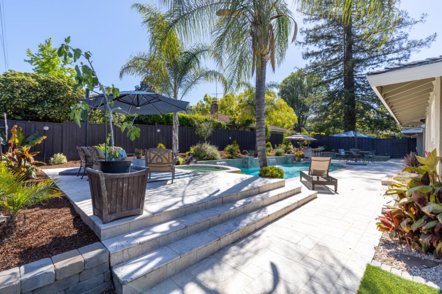 102 Old Orchard Drive Los Gatos, CA 95032 - Photo 32 of 33 a patio with table and chairs and potted plants