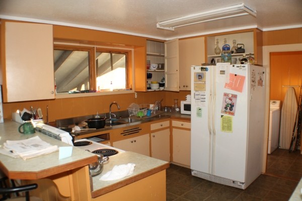 4959 La Road Kapaa, HI 96746 - Photo 4 of 15 a kitchen with stainless steel appliances a refrigerator and a stove top oven