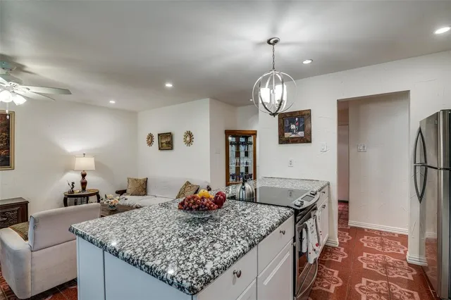a view of a kitchen and dining table