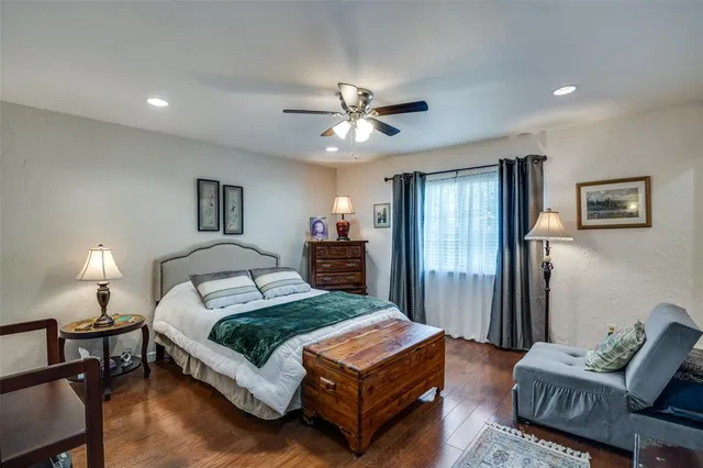 a bedroom with a bed window and couch